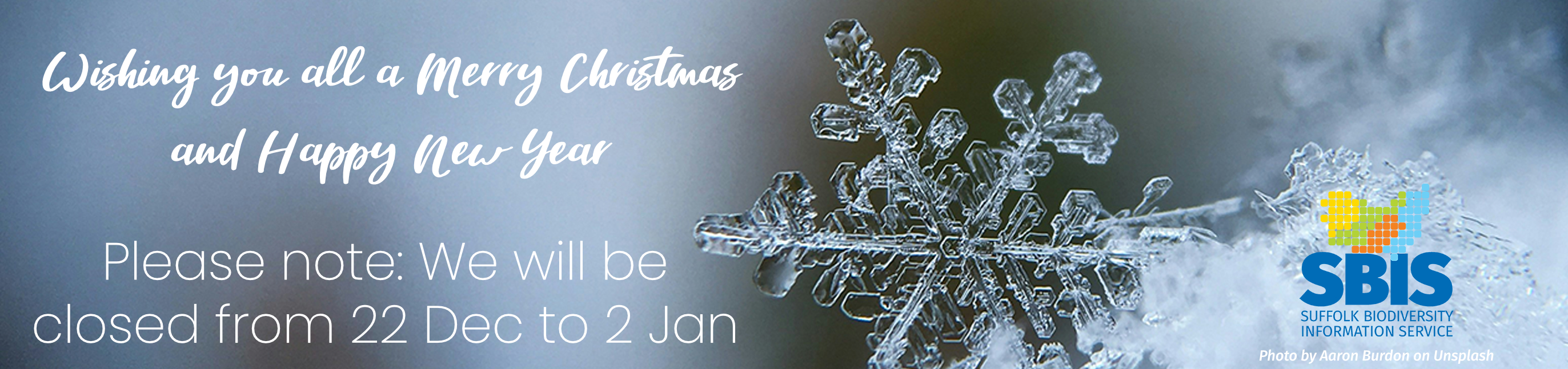 A background image with a close up of a snowflake displaying this text: Wishing you all a Merry Christmas and a Happy New Year. Please note: We will close at 5pm on the nineteenth of December and reopen on the fifth of January.